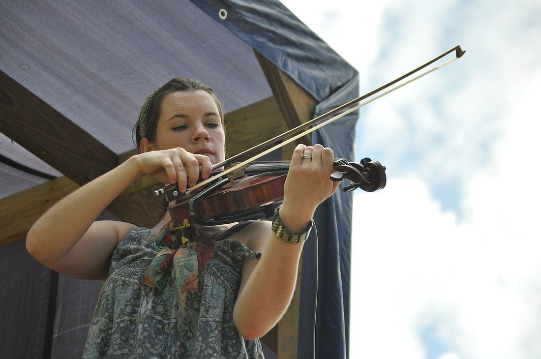 Sara Moone plays violin with Passerine, one of seven bands that played over the two-day festival. FILE PHOTO BY SHANNA FORTIER