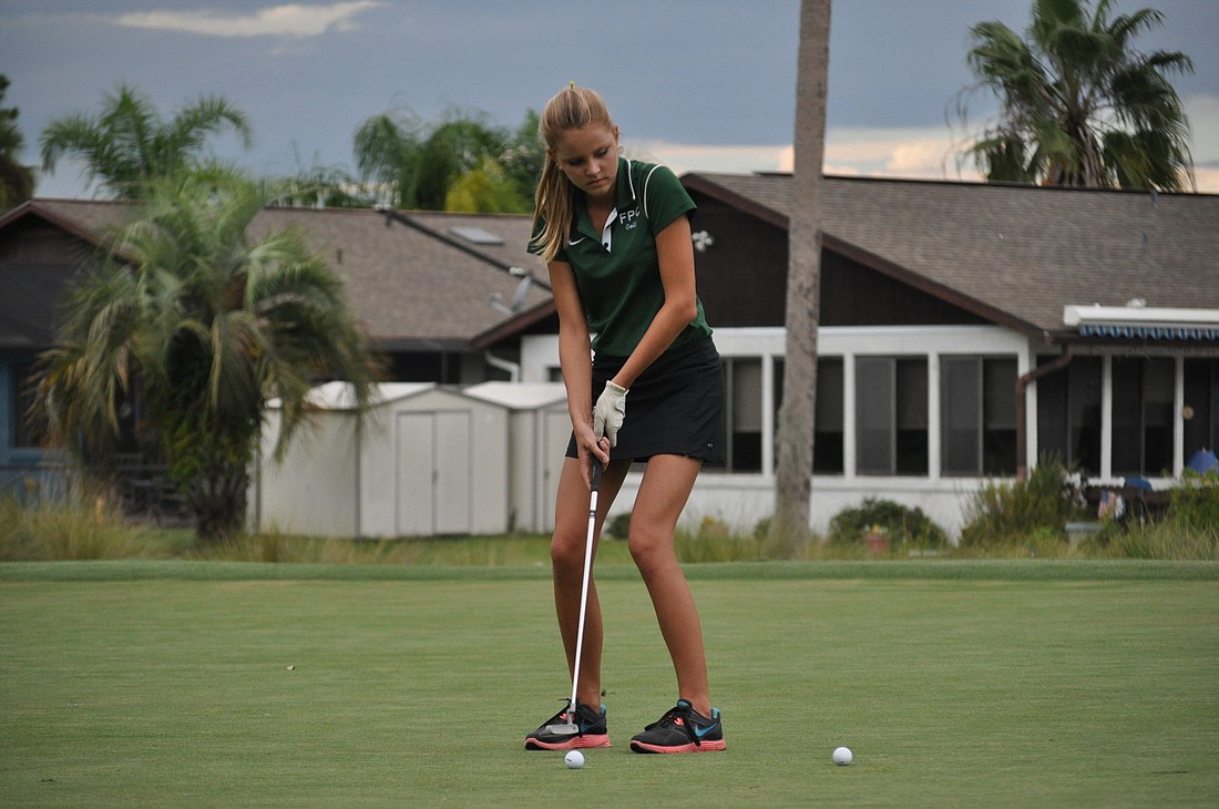 Flagler Palm Coast's Becky Rawls putts the ball Monday in a match against Matanzas at the Palm Harbor Golf Club. PHOTOS BY ANDREW O'BRIEN