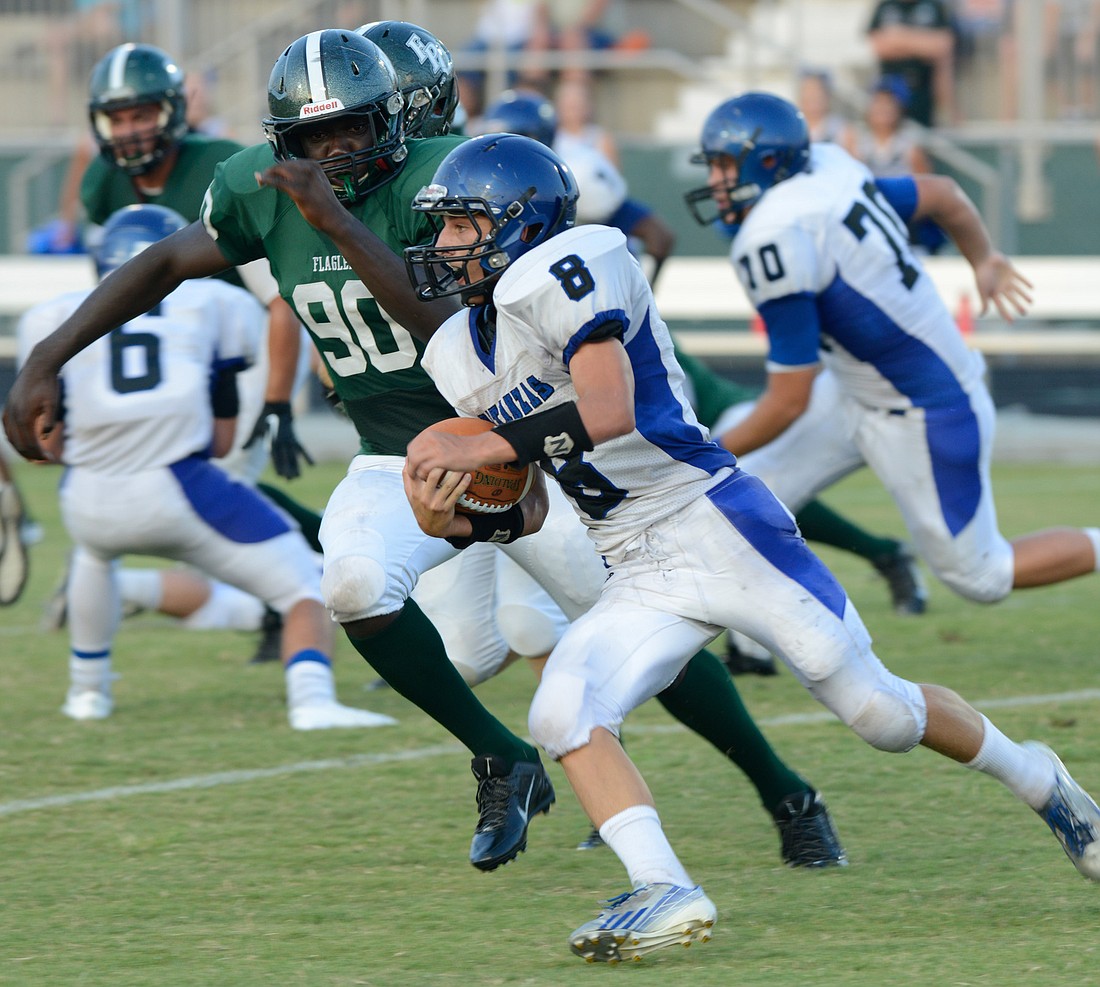 Flagler Palm Coast's Dougladson Subtyl chases down Matanzas' Stefan Tucker earlier this season. FILE PHOTO