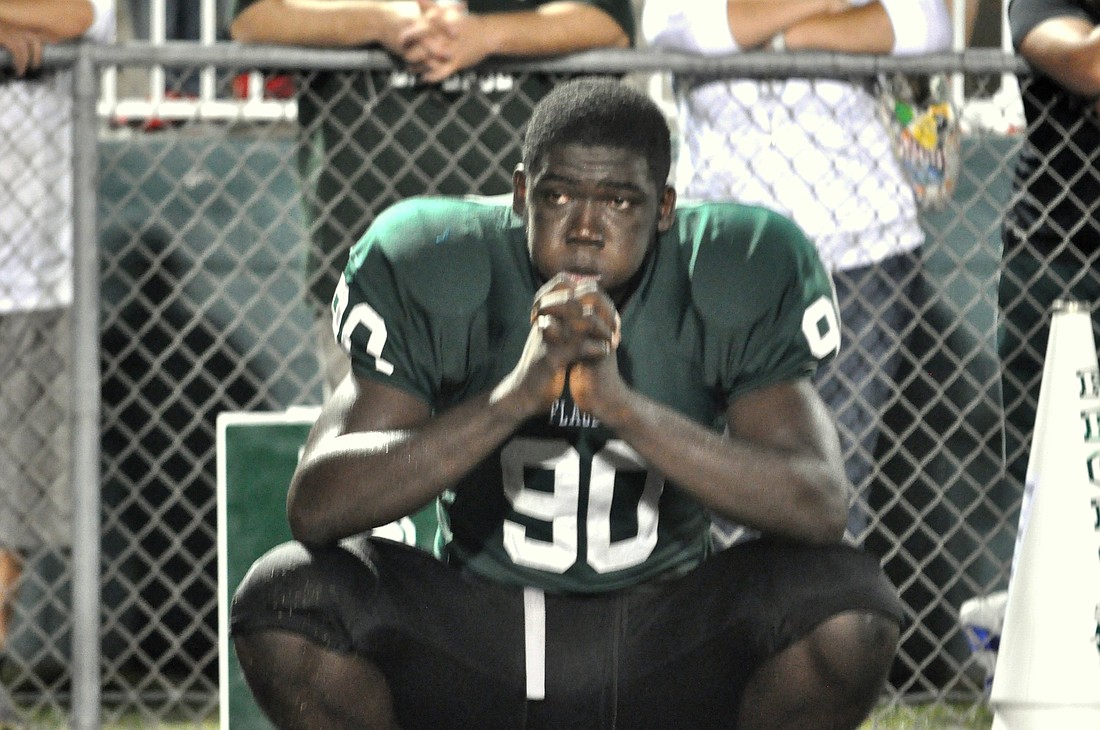 Flagler Palm Coast defensive end Dougladson Subtyl stares onto the field following his team's 35-34 overtime loss to First Coast. (Photos by Andrew O'Brien)