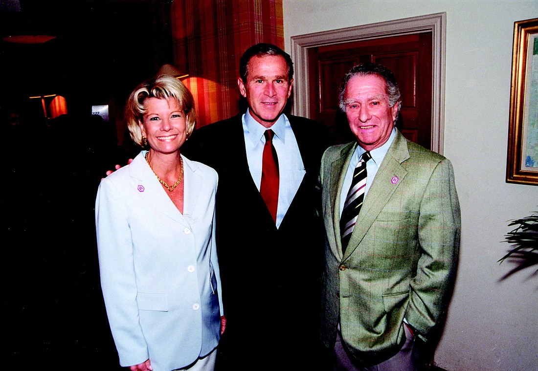 2001. Former President George W. Bush, center, with Katie Moulton and Klauber, stayed at the Colony on Sept. 10, 2001.