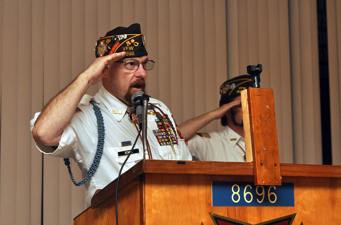 Palm Coast VFW Post 8696 Cmdr. Ronald Stark salutes the flag. PHOTOS BY SHANNA FORTIER