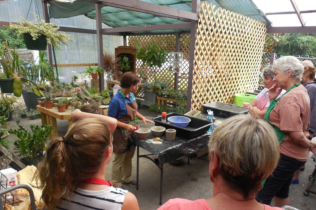 Hammock Gardens Nursery & Landscaping co-owner Janine Regina Fonseca leads a hypertufa pot workshop. (Courtesy photo.)