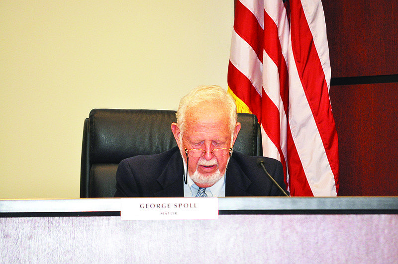 Mayor George Spoll reads through the Town Commission's regular meeting agenda Monday, Oct. 4, at Town Hall.