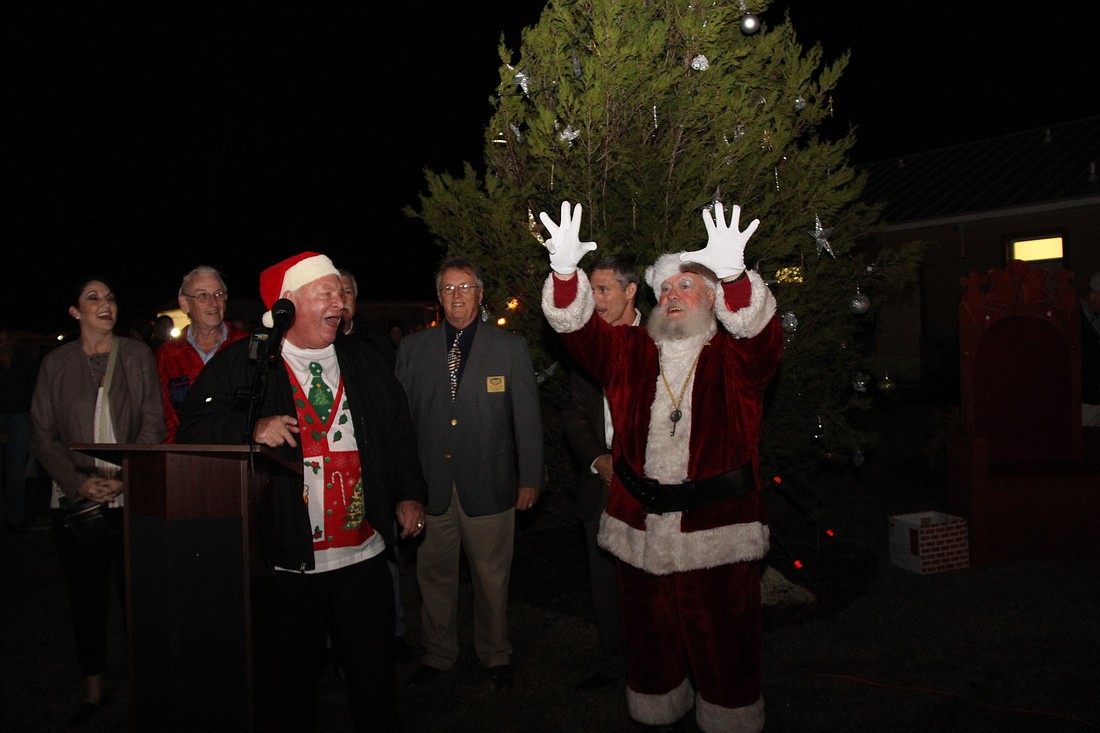 Palm Coast Mayor Jon Netts and Santa count down at a past Palm Coast tree lighting. FILE PHOTO BY SHANNA FORTIER