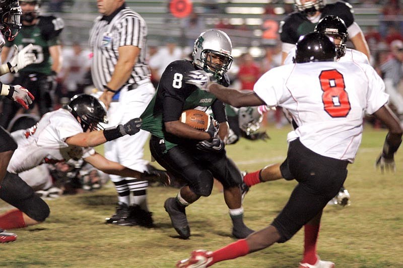 Senior tailback Taryn Laws rushed for more than 100 yards and three touchdowns in the Mustangs district opener.