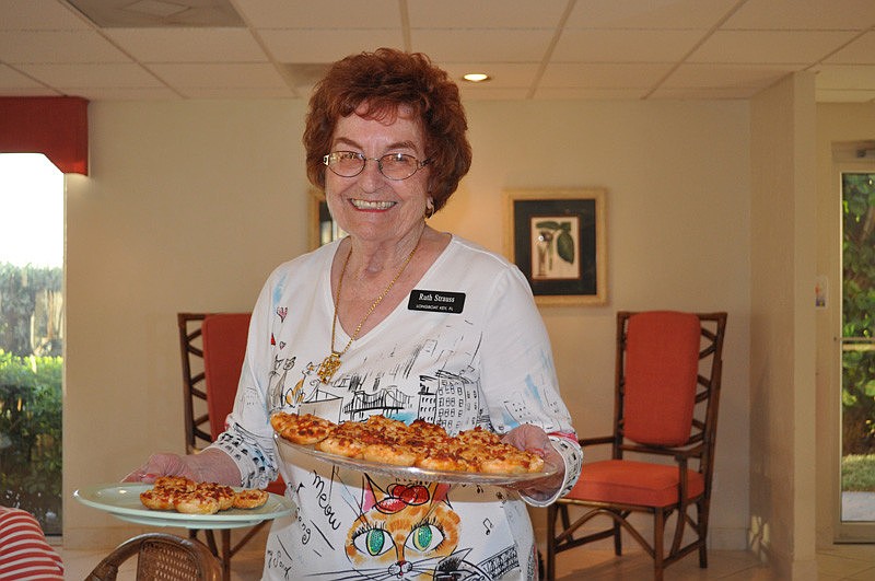 Ruth Strauss serves up some pizzas.