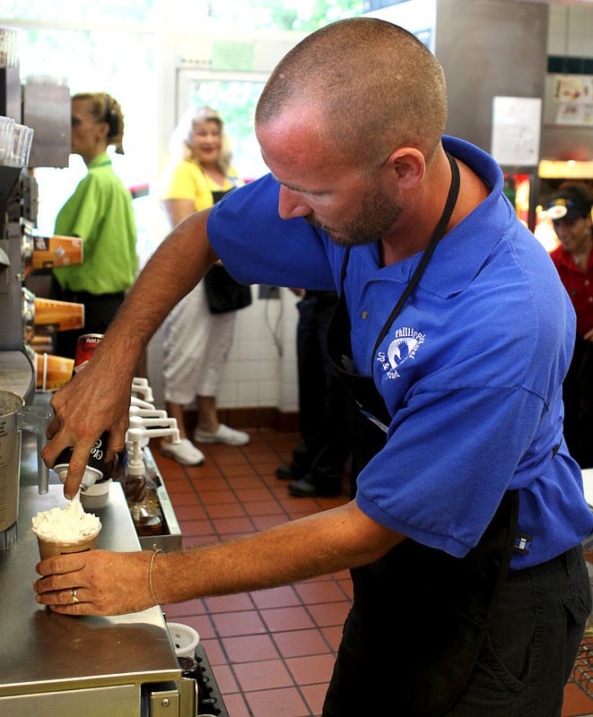 Second grade teacher, Jim Anderson, works at making a mocha.