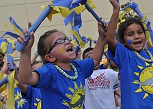 Kindergarten student Julia Craig, left, yelled "Go Sharks!" as loudly as she could.