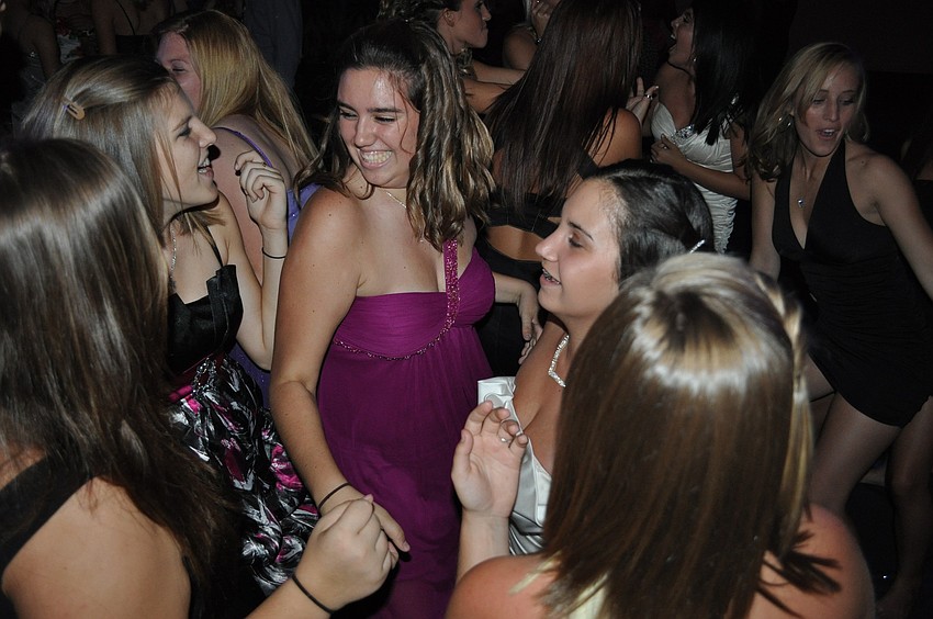 Seventeen-year-old Sarah McCoi, center, had a blast dancing with her friends.