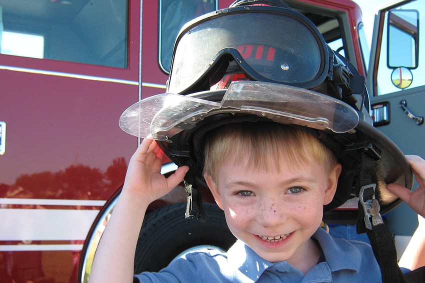 Ayden Kirk was all smiles as he tried on a firefighter's helmet.