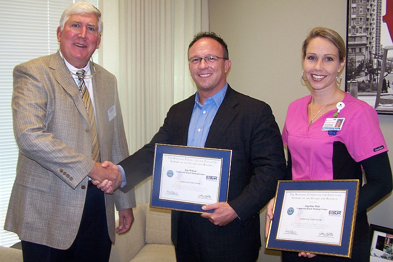 Lakewood Ranch Medical Center CEO Jim Wilson and Clinical Nurse Manager Angeline Hale received the Patriot Award from ESGR's Dave McCormick.
