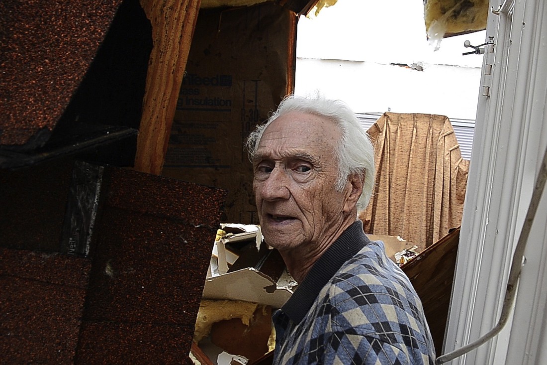 Palm Coast resident John Coberly shows the damage the tornado caused at his B-section home. (Photo by Steven Sobel)