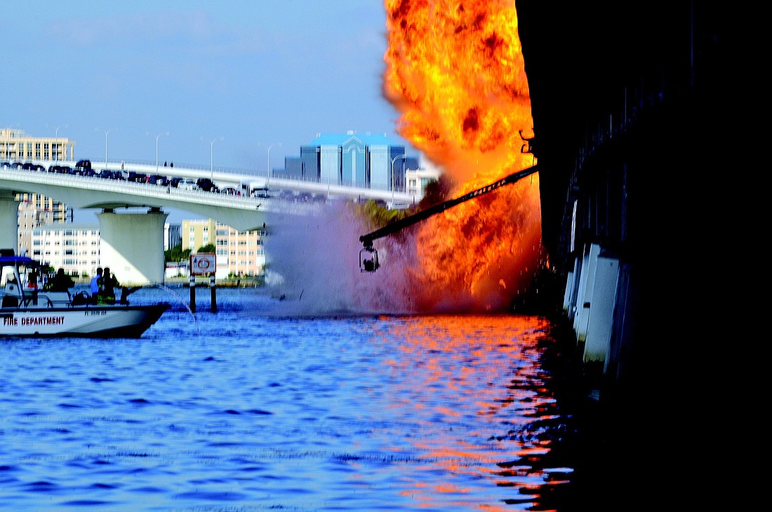 The final action scene of the new TV series, "Miami 24/7" includes a fiery explosion on the John Ringling Causeway.