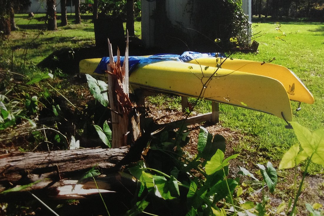 Palm Coast resident Gene Yavorski took this picture of his neighbor's two kayaks, which didn't budge from their position atop a pair of sawhorses even as the tornado ripped the tree next to them in two. (Courtesy photo by Gene Yavorski)