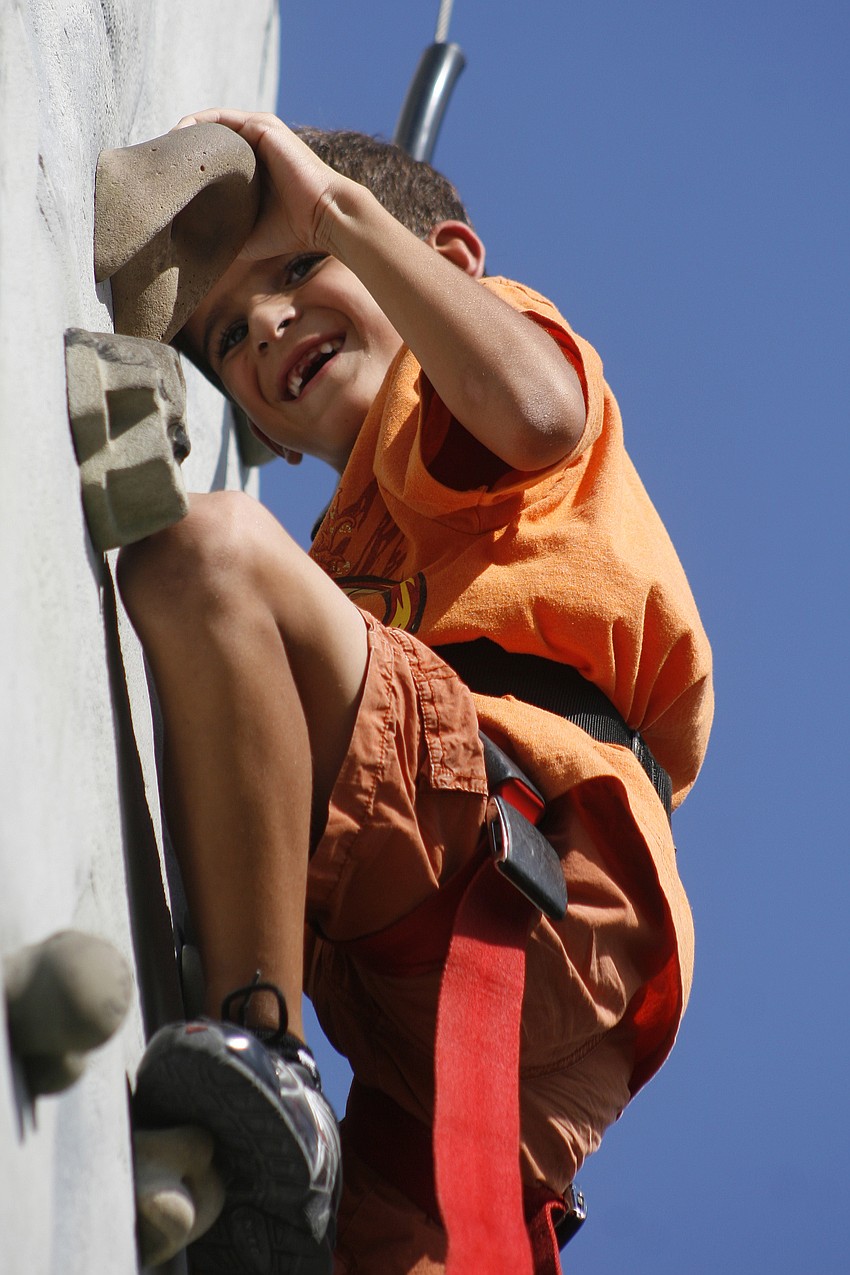 Nicholas Bowie, 6, made it all the way to the top of the rock-climbing wall challenge.