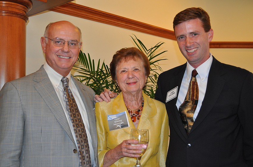 President of the Board of Directors David Cruikshank, Ginny Morrish and Josh Kollman