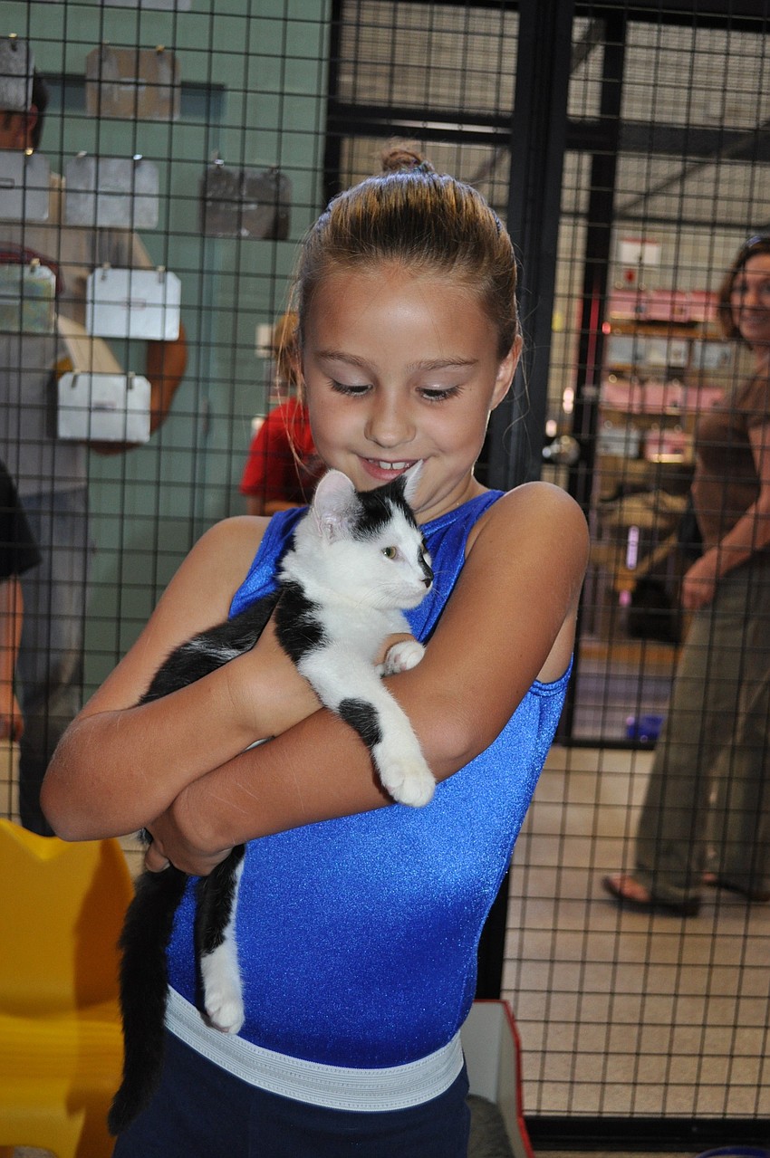 Avery Underahl cuddles up with a kitten.