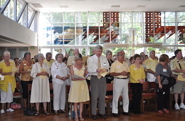 The congregation dressed in yellow and gold, Baldino's favorite colors.