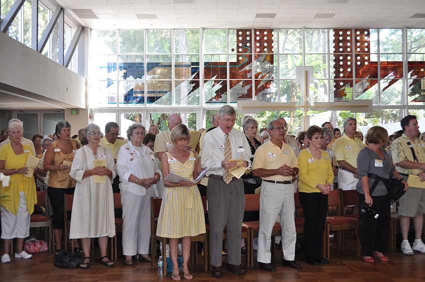 The congregation dressed in yellow and gold, Baldino's favorite colors.