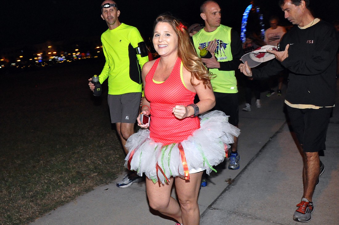 Lois Duncan prepares to officially earn her finisher's medal. PHOTOS BY SHANNA FORTIER