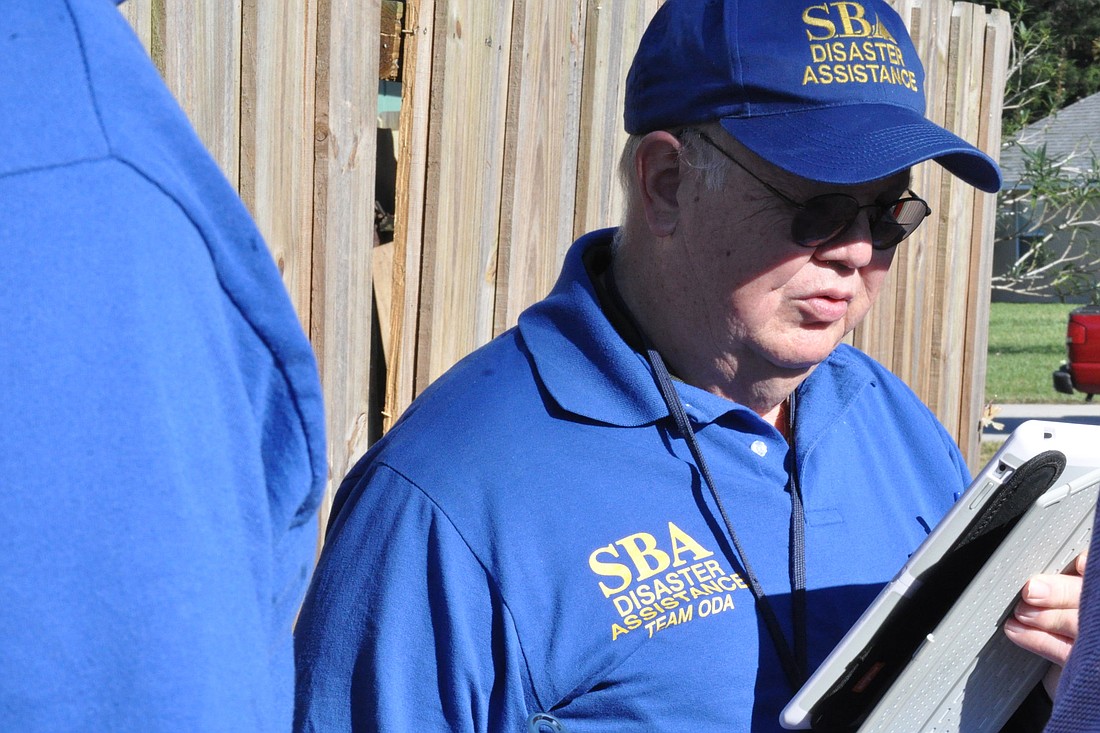 Bill Singleton, of the U.S. Small Business Administration, assesses damage last month caused by the Starlight Tornado. City officials don't expect aid. (File photo by Jonathan Simmons)