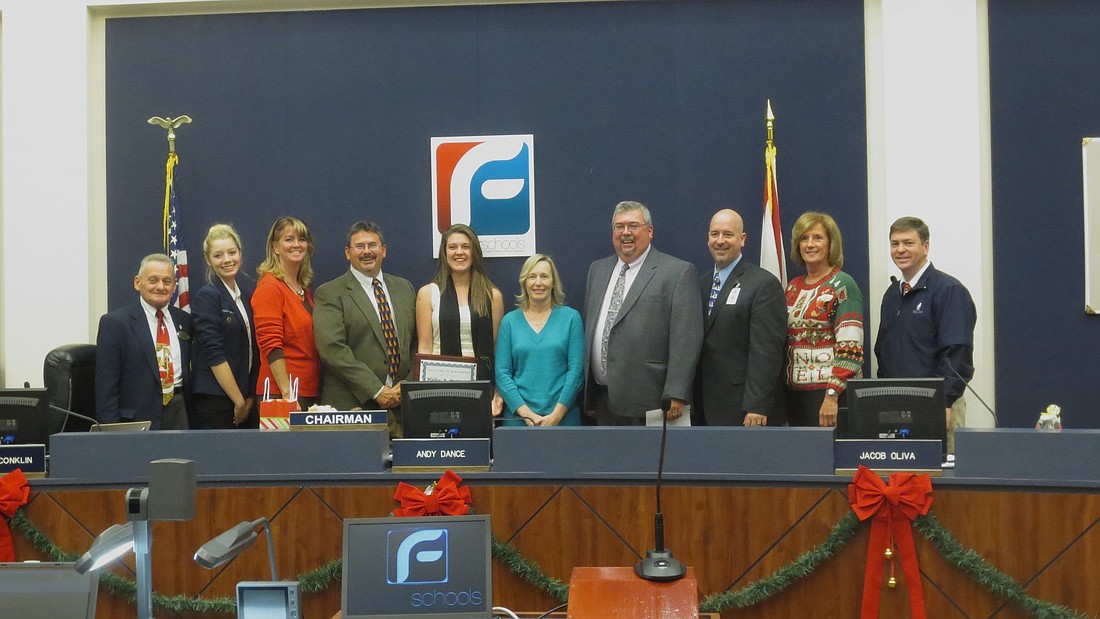 Sunshine State Scholar Haley McQueen (center) pictured with the Flagler County School Board COURTESY PHOTOS