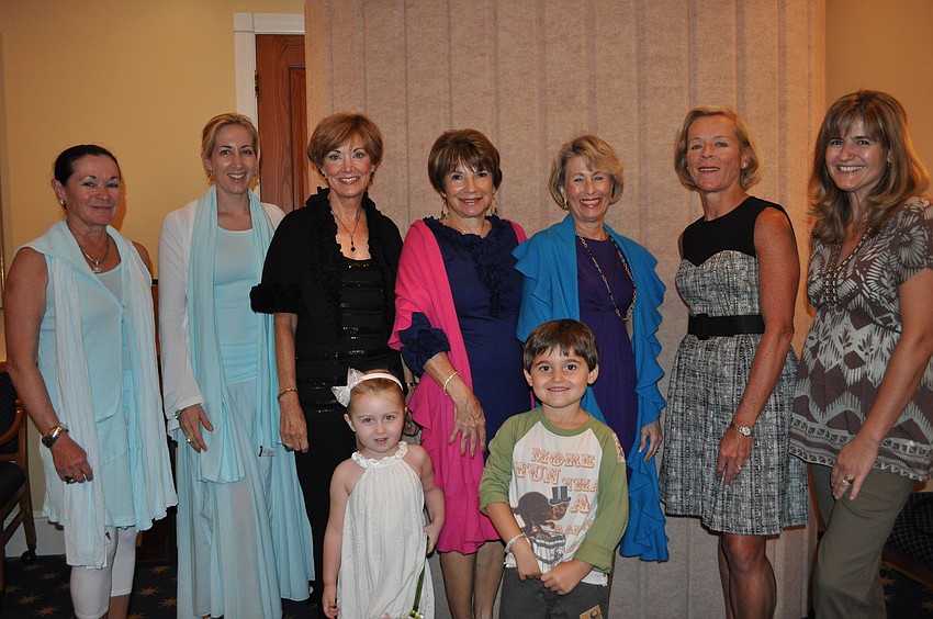 Models from left: Jan Holly, Rena Nietz, Karin Jones, Ronni Minnig, Angela Freeman, Marie Hunter, Alessandra Massaro. Front row: Rena Nietz, age 3, and Louie Massaro, age 4.