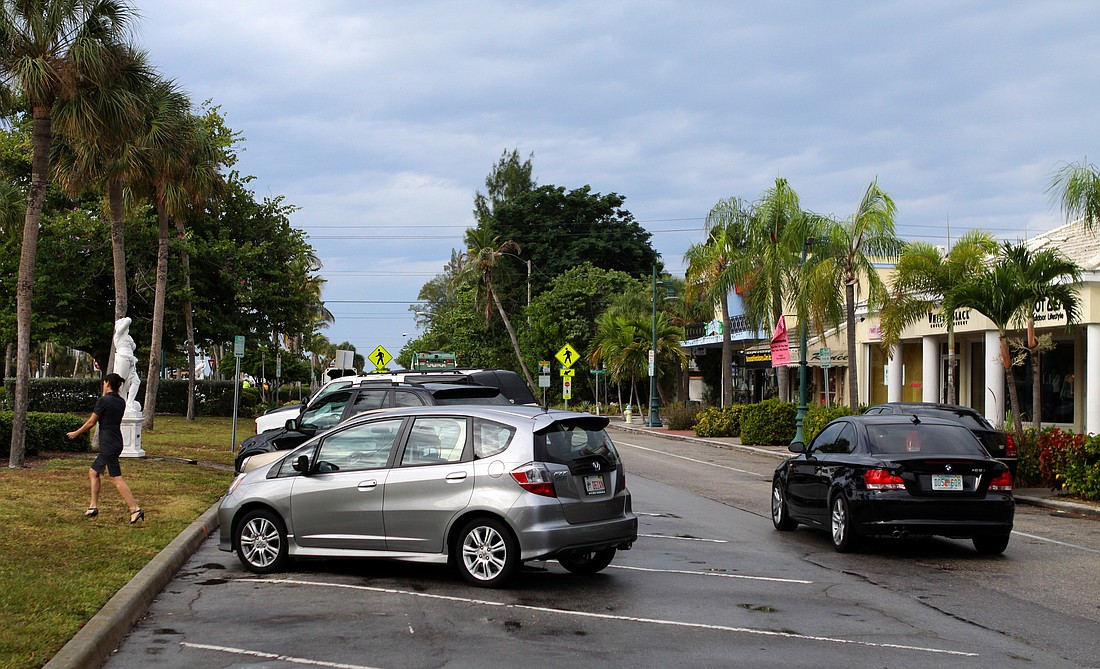 Parallel parking spaces on the right side of the road will remain on John Ringling Boulevard.