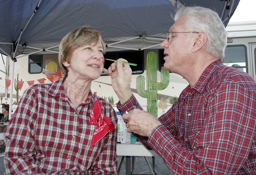 Sarasota Baptist Church members Mary and Joe Brannon volunteered to work the face painting booth.