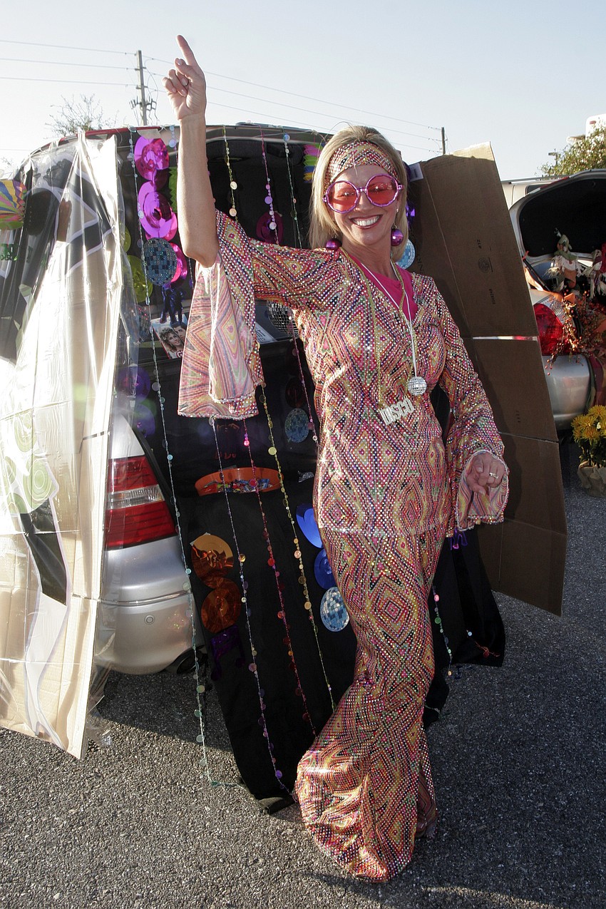Disco Queen Melinda Slicis passed out candy during trunk-or-treat.