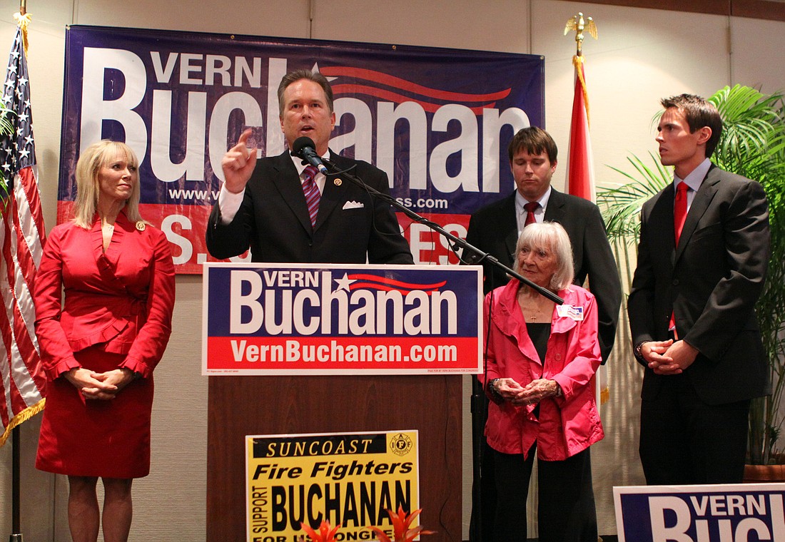District 13 Rep. Vern Buchanan waves to a packed room Tuesday night at Sarasota Yacht Club during his victory speech.