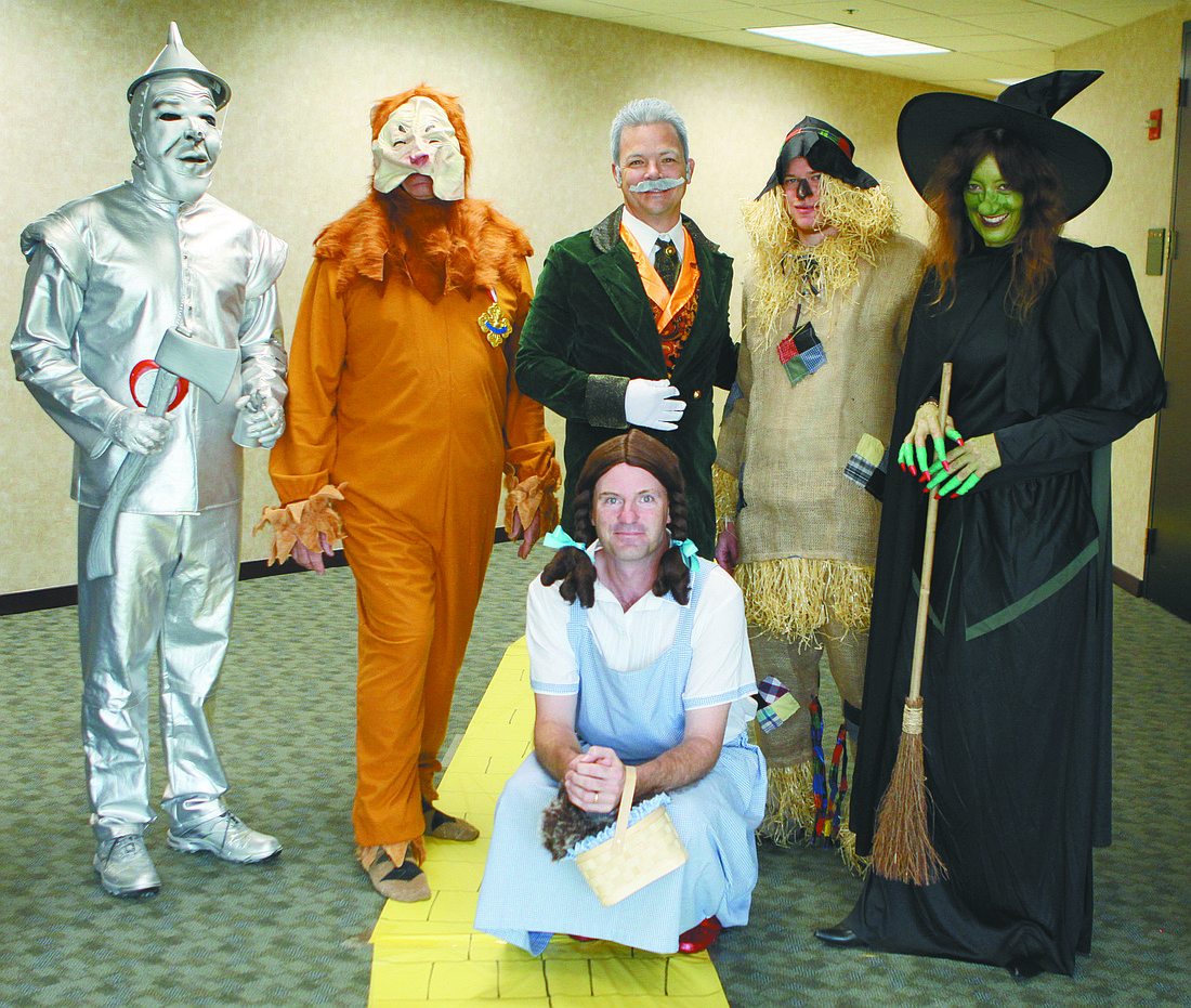 Steve McDonald, the Tin Man; Larry Fraczak, the Cowardly Lion; Jim Danko; the Wizard of Oz; Kellen McDonald, the Scarecrow; Camille Young, the Wicked Witch of the West; and Jay Henderson, Dorothy.