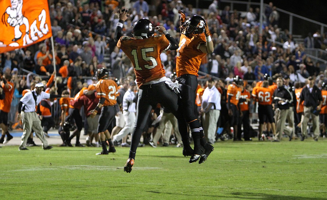 Sean Hurley and Jake Desrosiers celebrate HurleyÃ¢â‚¬â„¢s game-winning touchdown during Friday night's game.