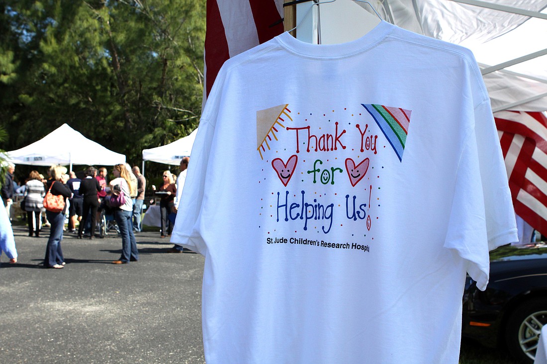 A St. JudeÃ¢â‚¬â„¢s t-shirt hung on the side of one of the many tents at the luncheon and raffle on Saturday.