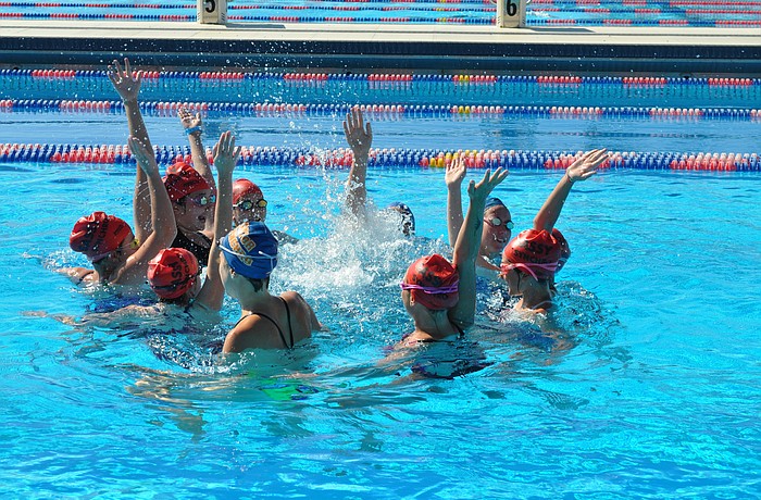A few of the SASSY girls and Gators do a final cheer to end their session.