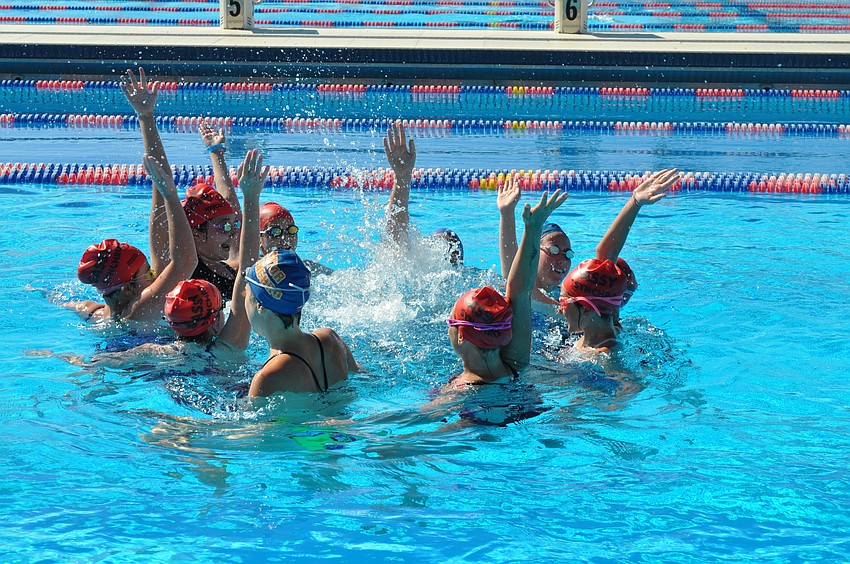 A few of the SASSY girls and Gators do a final cheer to end their session.