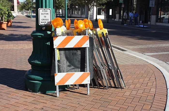 Workers are preparing to barricade streets in advance of Thursday's Veterans Day parade on Main Street.