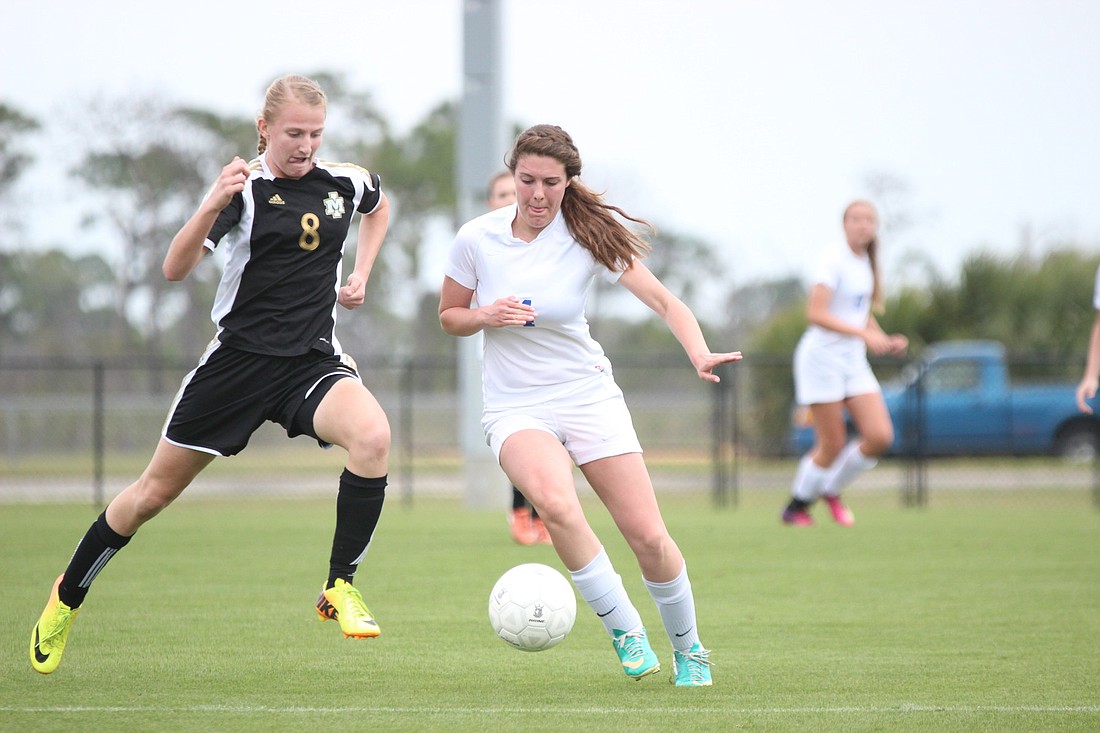 Matanzas' Haley McQueen battles for the ball Thursday afternoon against Merritt Island's Kayli Jacobs in the Class 3A semifinals. (Photo by Andrew O'Brien)