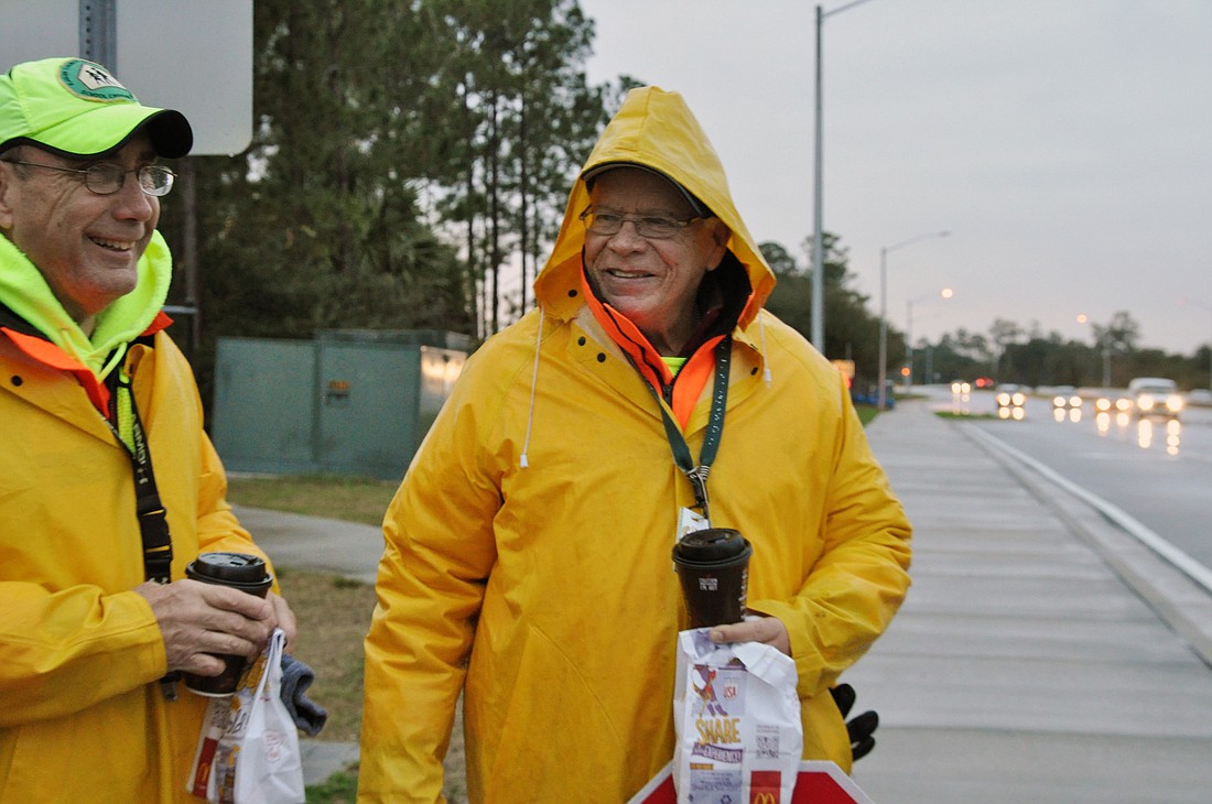 Crossing guards George Ã¢â‚¬Å“EdwardÃ¢â‚¬Â Wilson and Juan Salicrup were surprised with coffee and breakfast on Crossing Guard Appreciation Day. PHOTO BY SHANNA FORTIER