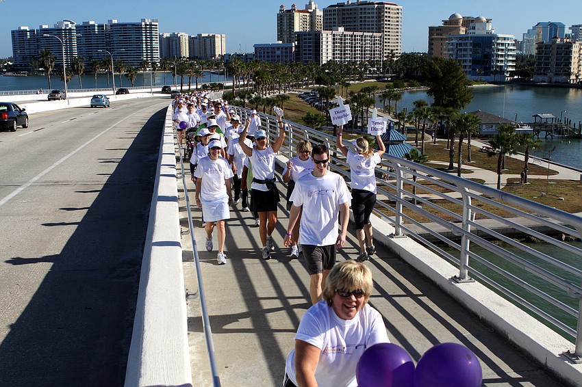 Participants in the Sarasota Walk make their way across the John Ringling Bridge.