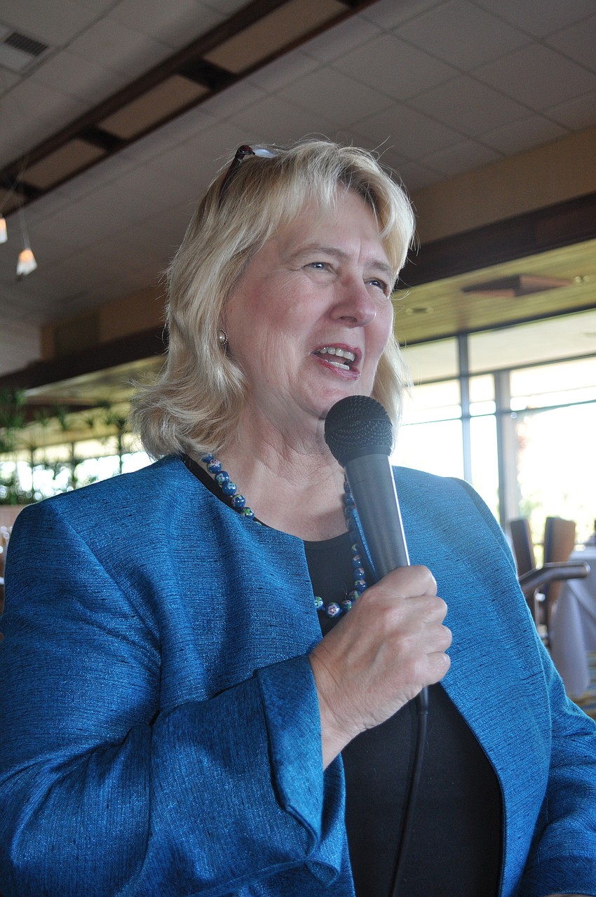 Dr. Susan MacManus speaks to the crowd of more than 75 people.