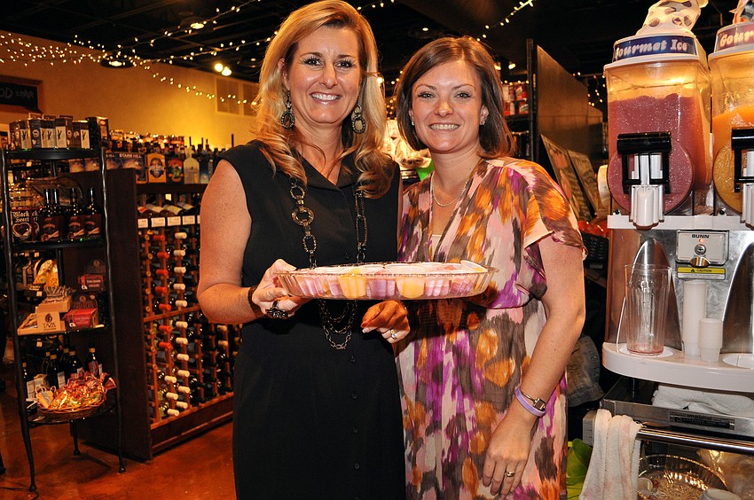 Kelly Abercrombie and Taylor McClain-Mock blend up samples of delicious frozen mimosa and red wine treats.