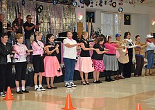 The St. Martha Catholic School teachers rock the hand jive.