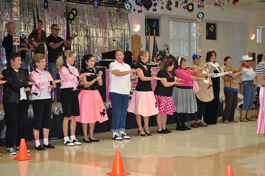 The St. Martha Catholic School teachers rock the hand jive.