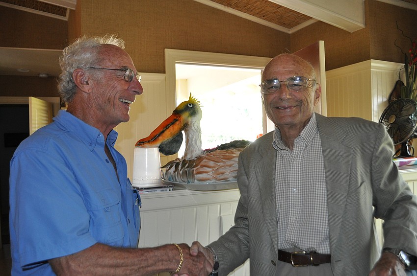 Pelican Harbor Association Vice President Gus Swoboda and Sheldon Kahn.