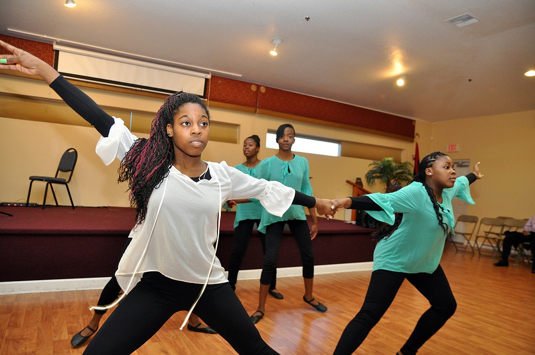 Angel Hopkins dances with the liturgical dance ministry of Mount Calvary Baptist Church. PHOTOS BY SHANNA FORTIER