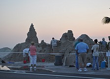 Team Santastic began building its 80-ton sand structure Wednesday on Bradenton Beach.