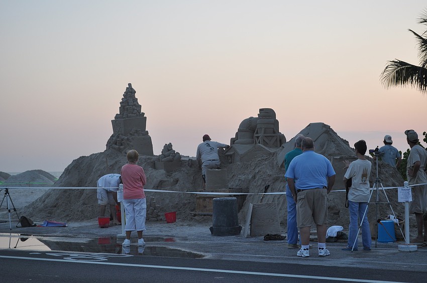 Team Santastic began building its 80-ton sand structure Wednesday on Bradenton Beach.