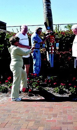 Nancy Krieger, Matt Krieger, Bob Havel and Ed Ryan put up holiday decorations last week at The Castillian.